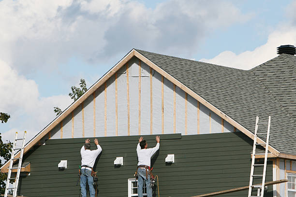 Professional Storm Damage Siding Repair technician working in Arlington, MA